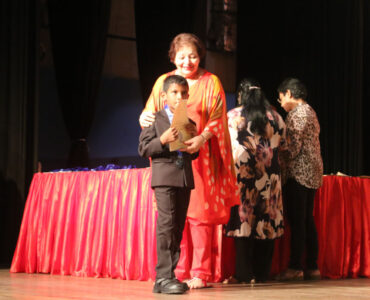 Principal Wendy Holsinger with a young prize winner